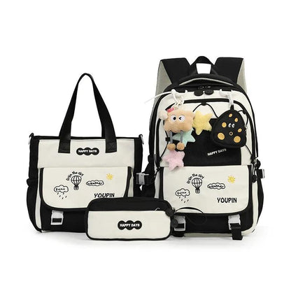 Black kids backpack set with plush charms, front panel pocket, and matching tote bag