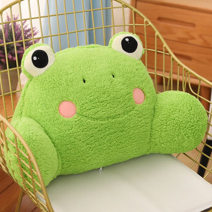 Plush green frog cushion with big black eyes and round pink cheek patches.