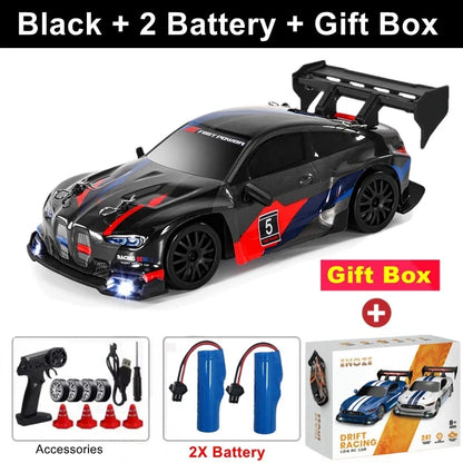 Black RC drift racing car with red side panel and black rear wing, 4x4 off-road style