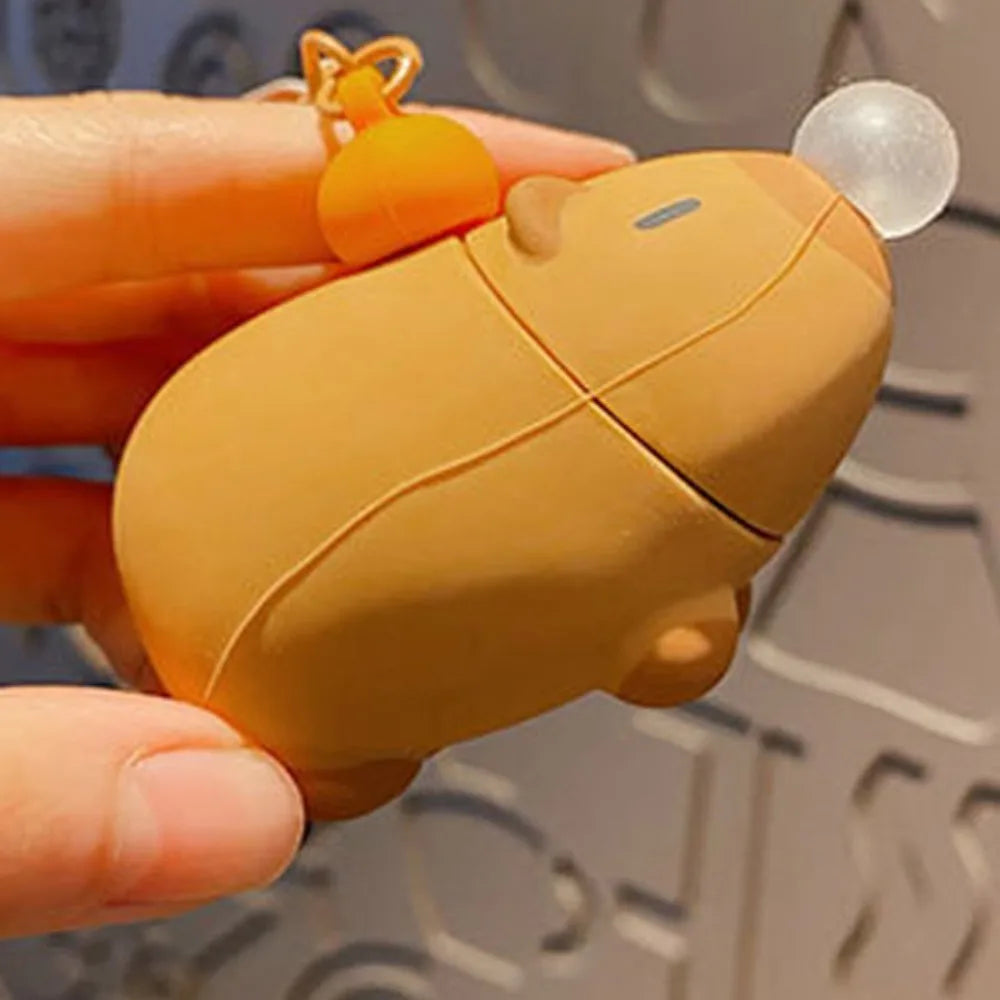 Capybara plush keychain close-up, brown body with seam lines and bubble dome