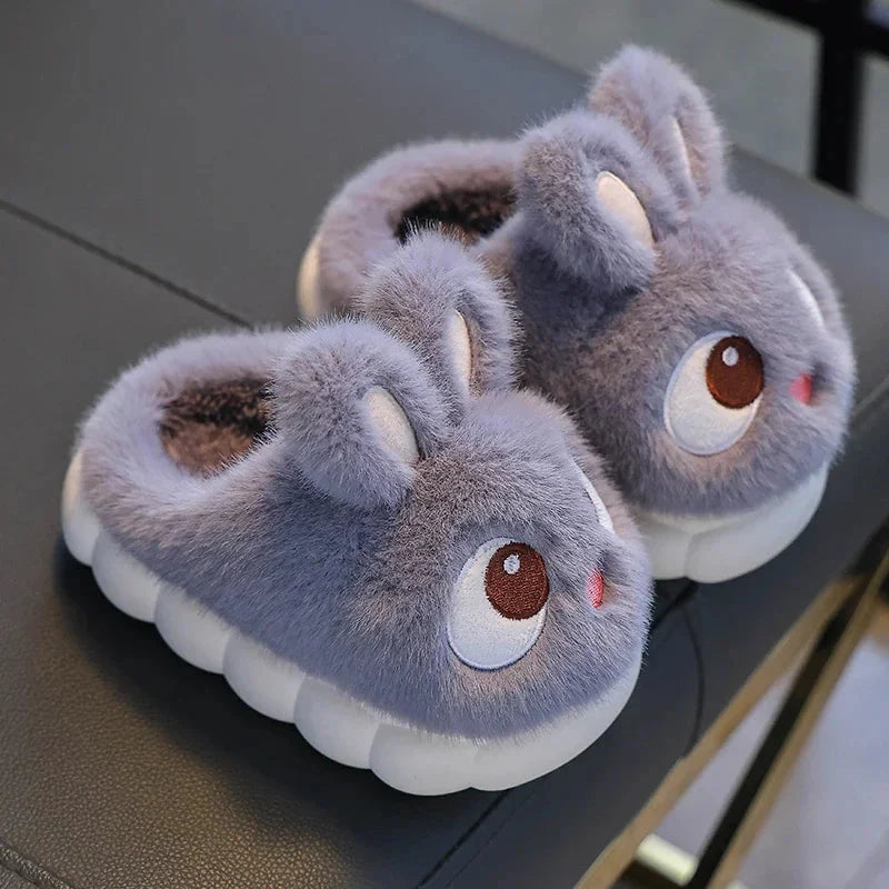 Kids rabbit plush winter slippers, fluffy gray with big brown eyes and tan ear tips