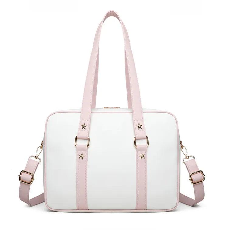 Kawaii messenger bag with white body and pink straps, star accents, and two front fastening straps