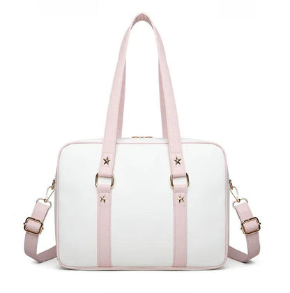 Kawaii messenger bag with white body and pink straps, star accents, and two front fastening straps