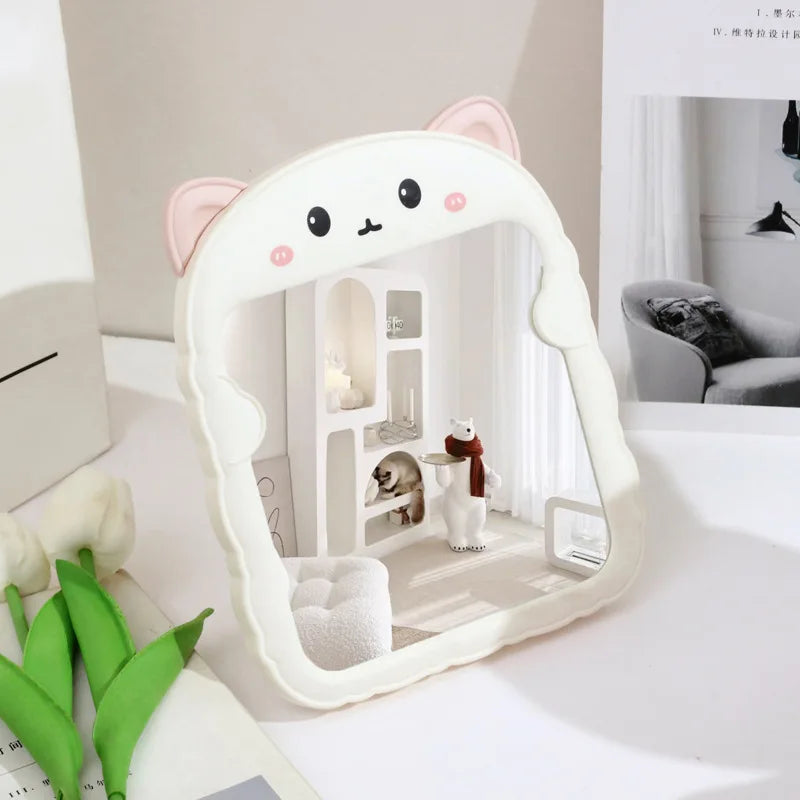 Cream animal-shaped desktop mirror with rounded frame, cat face, and arched body