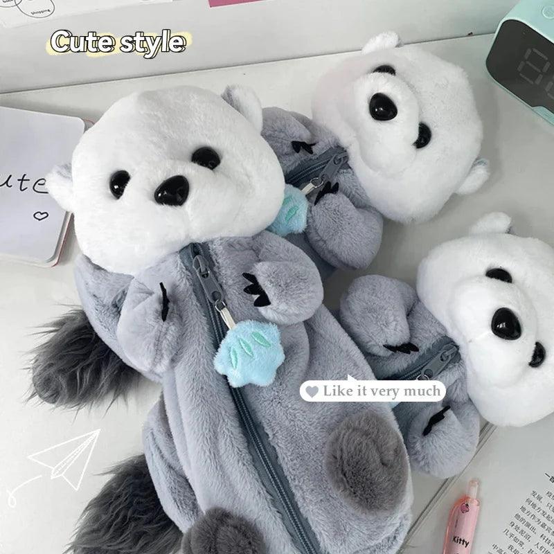 Otter plush pencil case in gray and white with blue star charm and zipper front