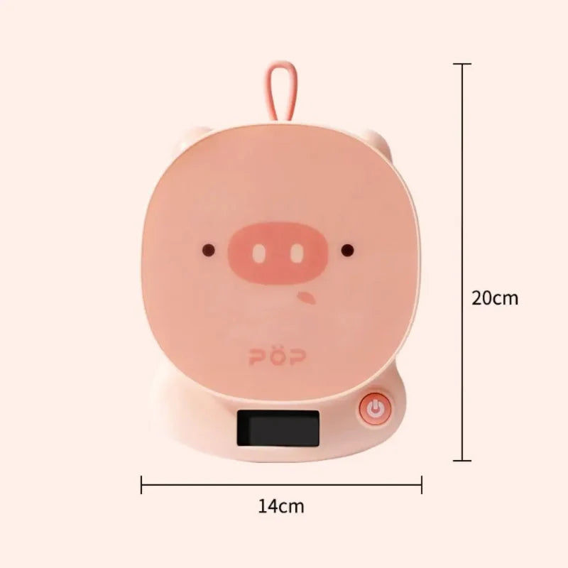 Pink pig-face digital kitchen scale with side power button and size outline