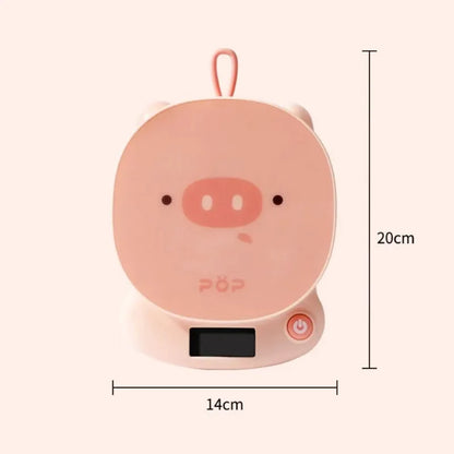 Pink pig-face digital kitchen scale with side power button and size outline