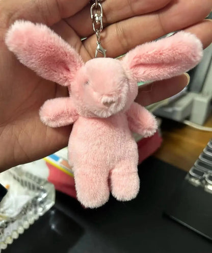 Pink rabbit plush keychain with metal clasp and short ears, hanging loop