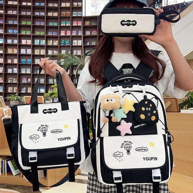 Black and white 3-piece backpack set with cartoon theme and adjustable shoulder straps