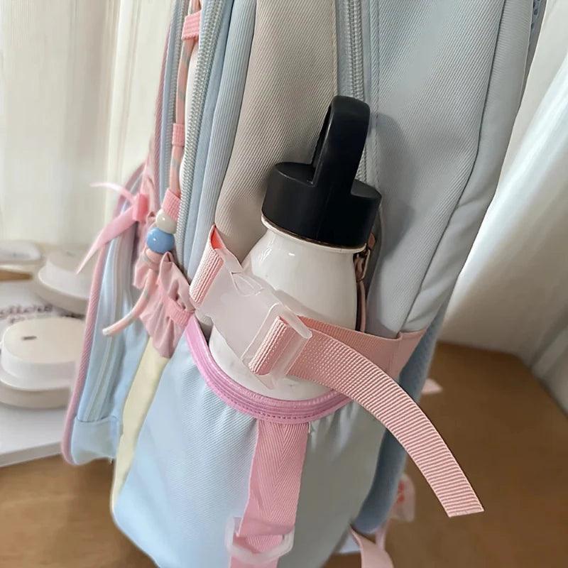 Pastel backpack side pocket with bottle holder strap and accessory clips