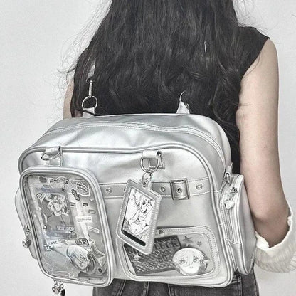 Pastel crossbody bag, silver, side view with front clear pockets and strap hardware