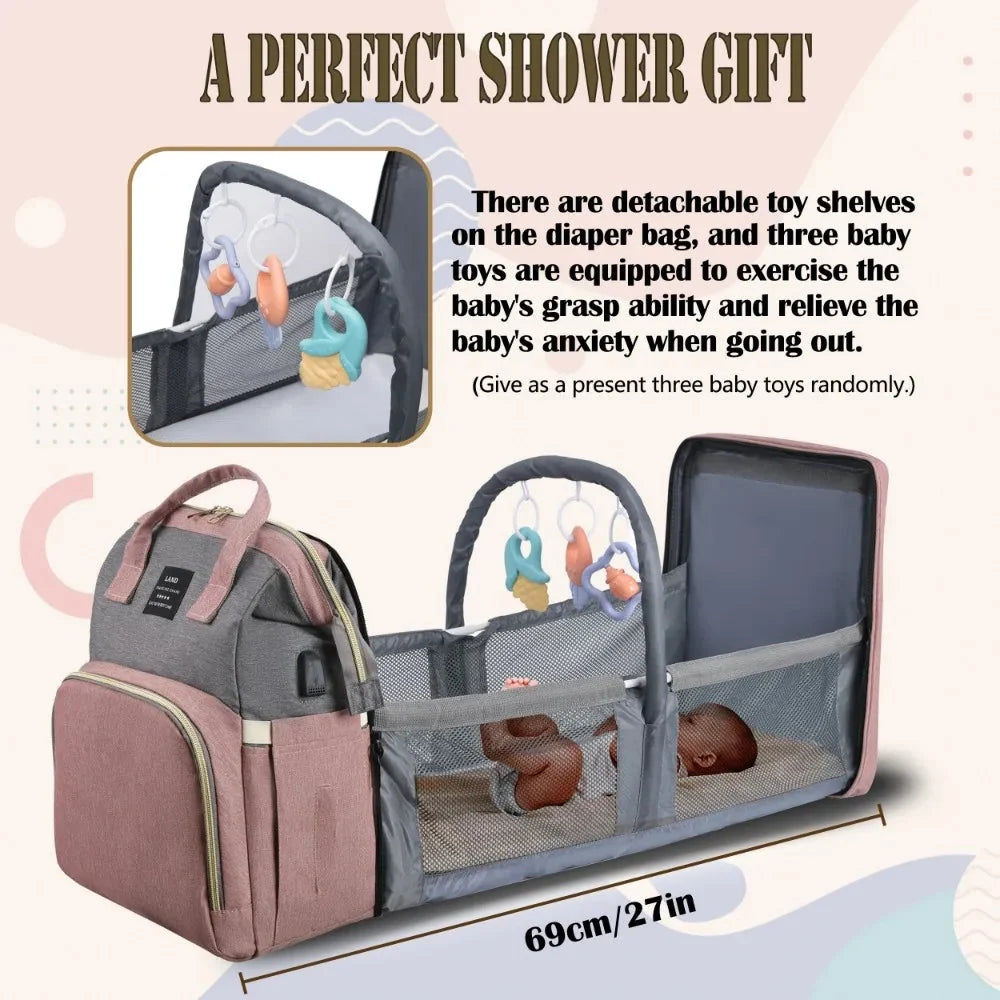 Fold-out travel crib bed with gray mesh sides and detachable toy shelf