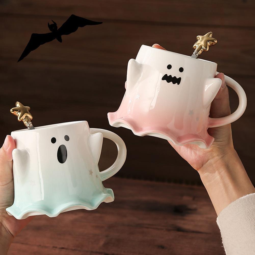 Ghost-shaped ceramic mug set with cartoon face, aqua and pink pastel edges, star details