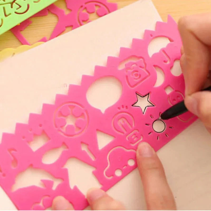 Pink plastic drawing stencil with large star and animal-shaped cutouts