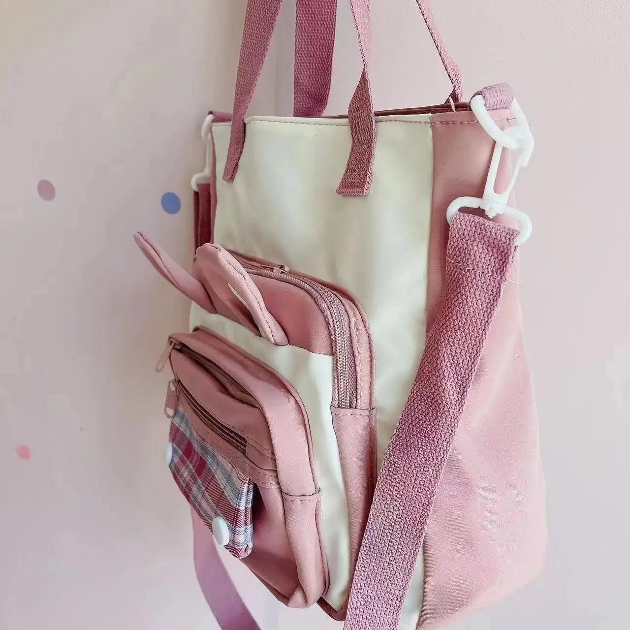 Pink bunny ears tote shoulder bag with side zipper pockets and wide shoulder strap