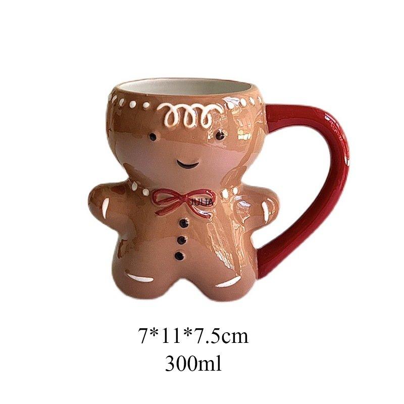 Gingerbread man mug with brown cookie body, white icing dots, and red handle