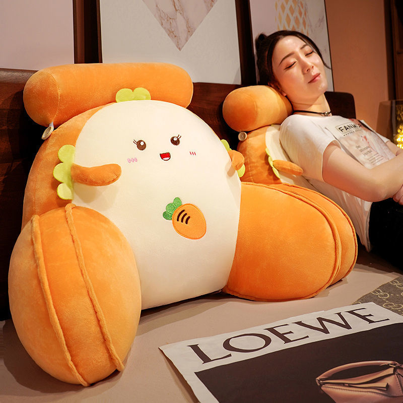 Orange and white plush reading pillow with duck face and padded wraparound support