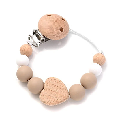 Baby pacifier clip with wooden heart bead and silicone beads, beige and light wood