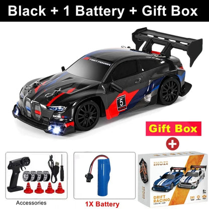 Black RC drift racing car with red accents and black rear wing, 4x4 off-road style