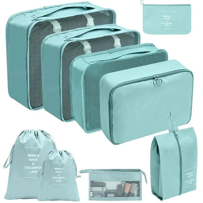 Teal packing cubes set with mesh panels and zippered storage pouches for travel.