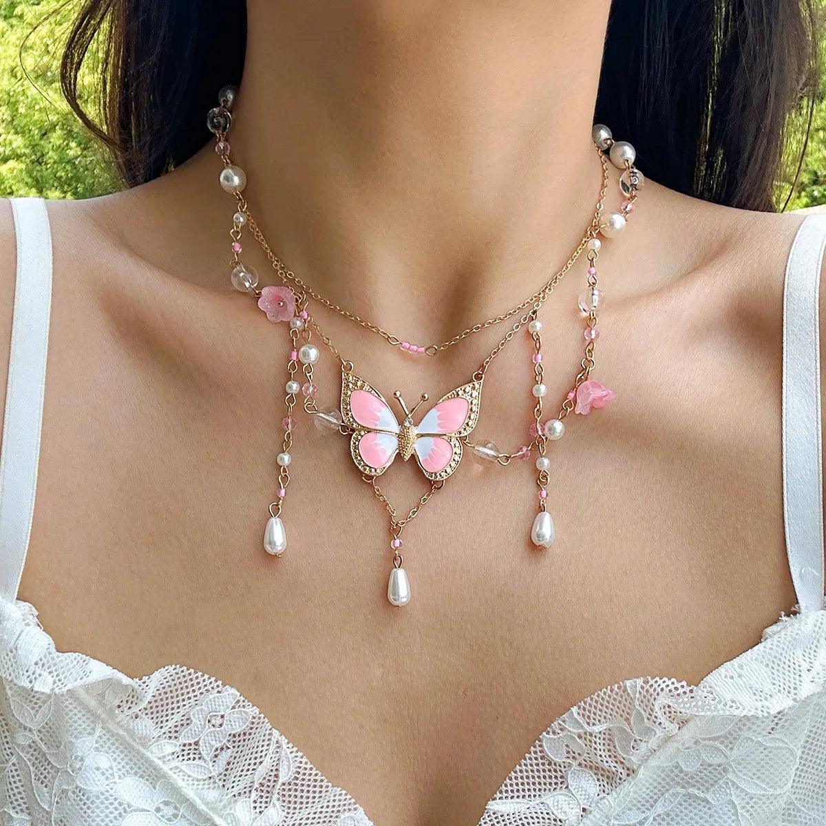Butterfly imitation pearl multi-layer necklace with pink beads, floral accents, and pearl drops