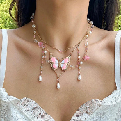 Butterfly imitation pearl multi-layer necklace with pink beads, floral accents, and pearl drops