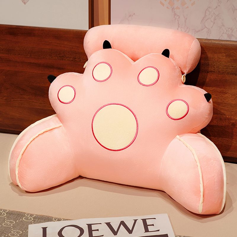 Light pink cat-paw reading pillow with black ear tips and pink outline circles