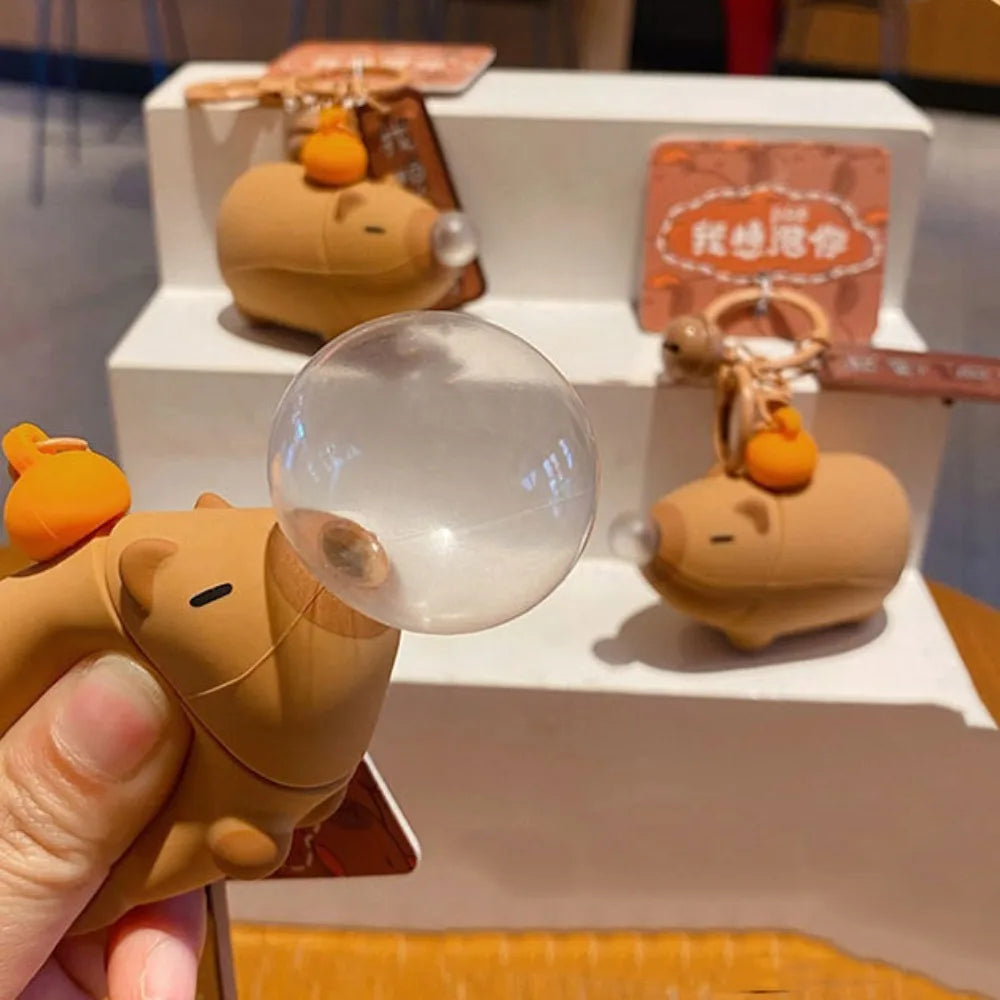 Capybara squeeze toy keychain set, clear bubble dome and small plush with tag