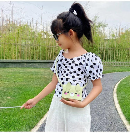 Children's bunny crossbody bag, light green with cute face graphic and shoulder strap