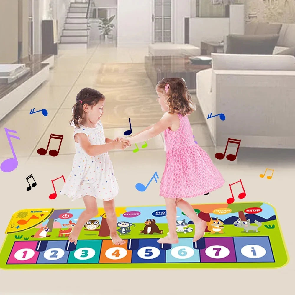 Children playing on a floor music mat with numbered keys and animal scene graphics