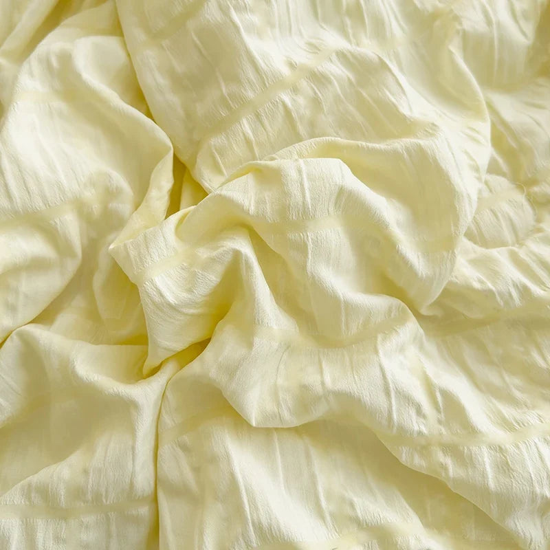 Yellow seersucker fabric detail with crinkle texture, folded for display