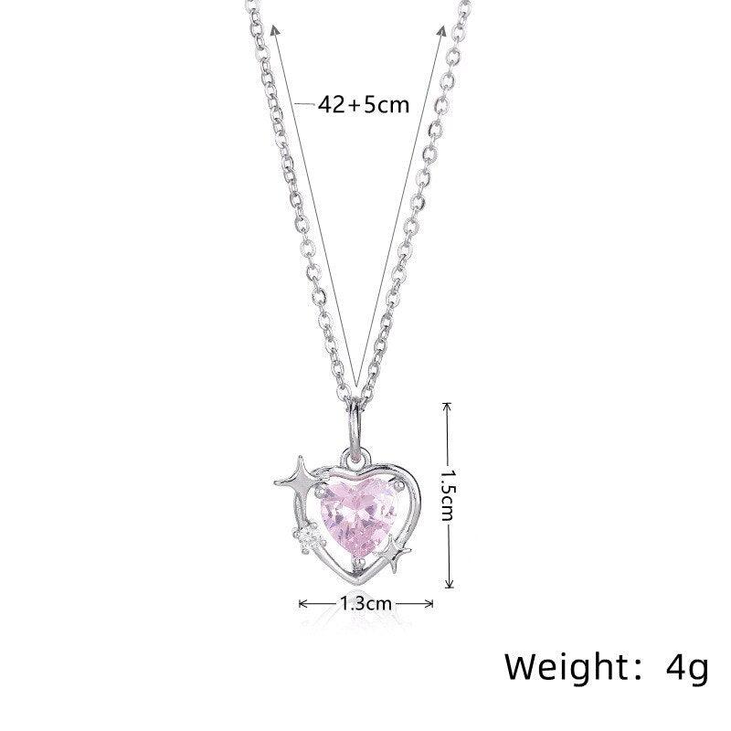 Heart crystal pendant necklace with silver-tone chain and pink faceted heart charm