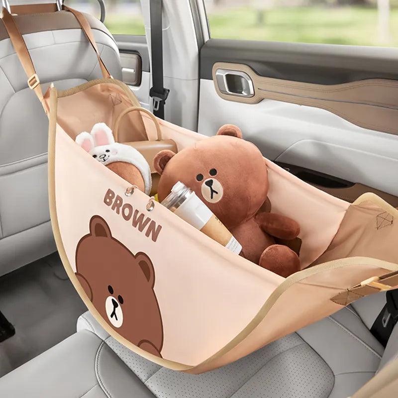 Car seat organizer bag in light brown fabric with bear print and bottle holder