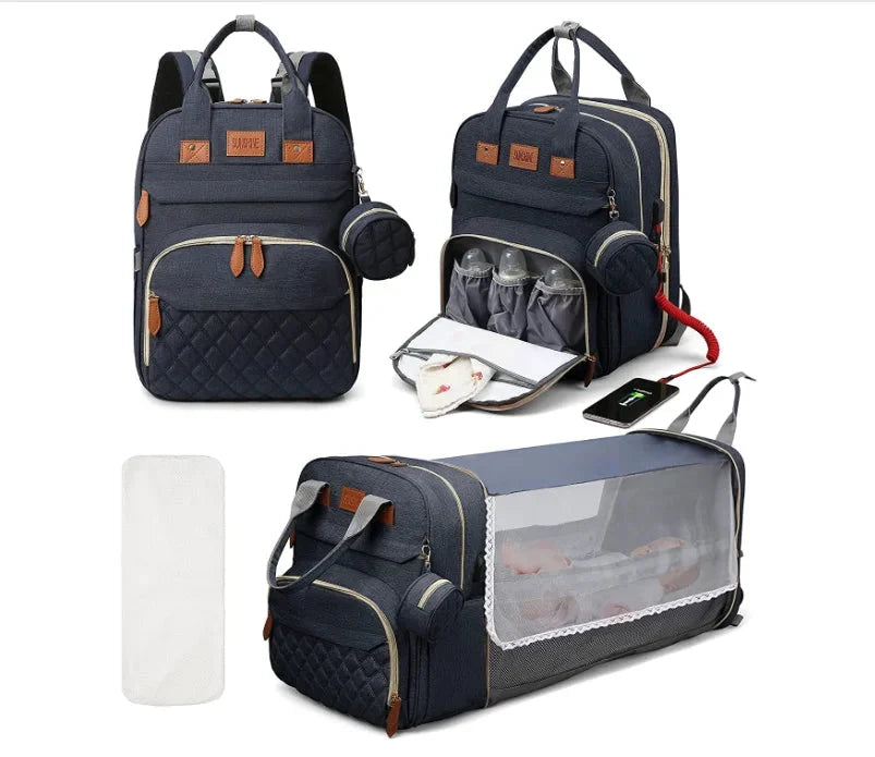 Navy diaper bag backpack with foldable baby bed, bottle pockets, and USB interface.