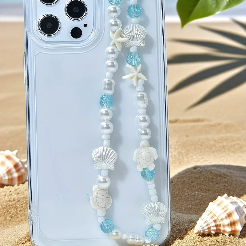 Pearl, blue bead, and shell phone charm bracelet with starfish and cowrie beads