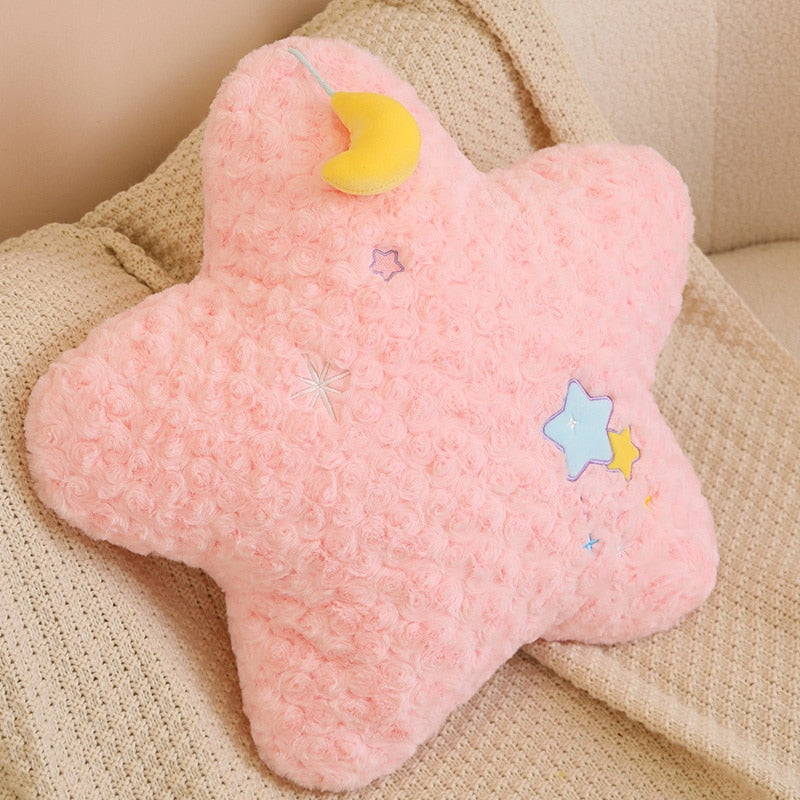 Pink moon plush pillow with yellow crescent cap and stitched star appliques