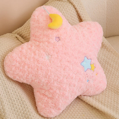 Pink moon plush pillow with yellow crescent cap and stitched star appliques