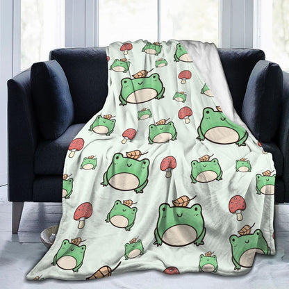 Flannel frog blanket in off-white with green and red cartoon frogs and mushroom pattern
