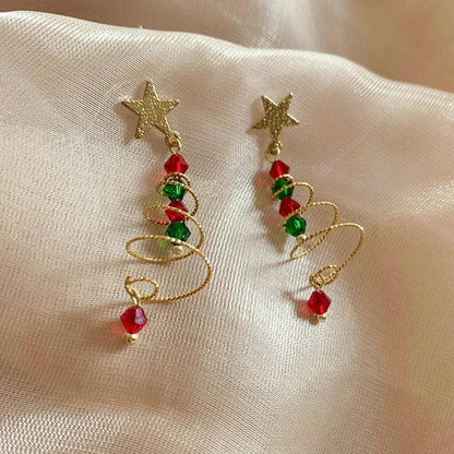 Gold-tone star and spiral drop earrings with red and green bead accents