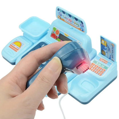 Blue electronic cash register toy held in hand, showing scanner and display