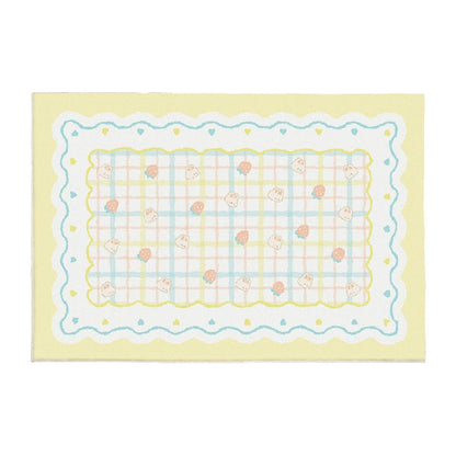 Pastel plush area rug with light blue stitched border and small bear icons on pale yellow