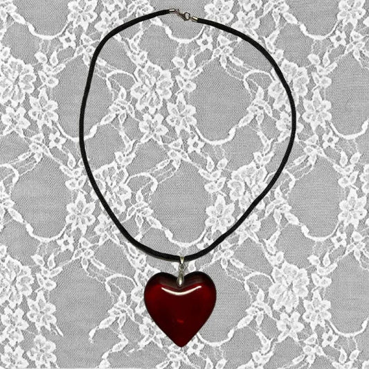 Black string necklace with red glass heart pendant