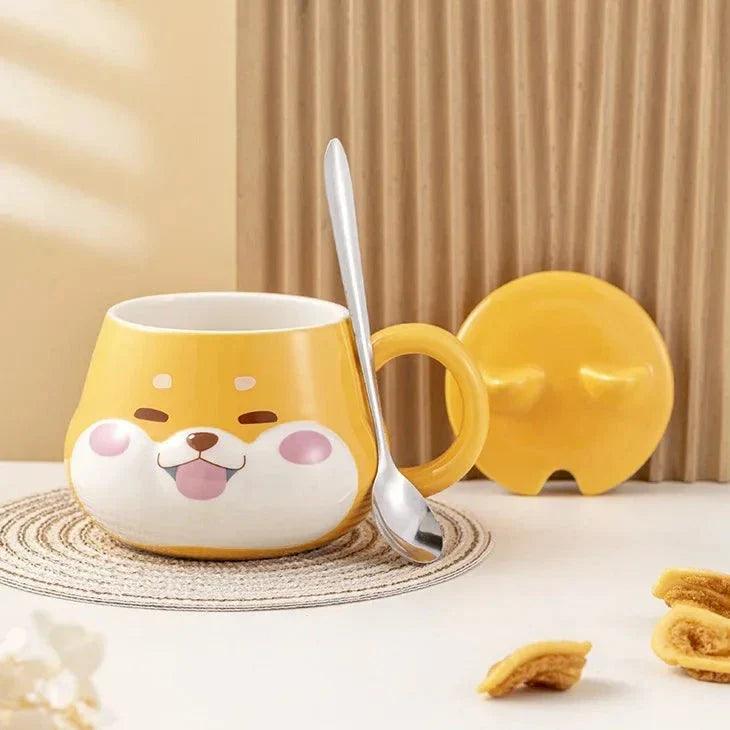 Yellow dog-face mug with spoon and lid propped beside it on a round coaster