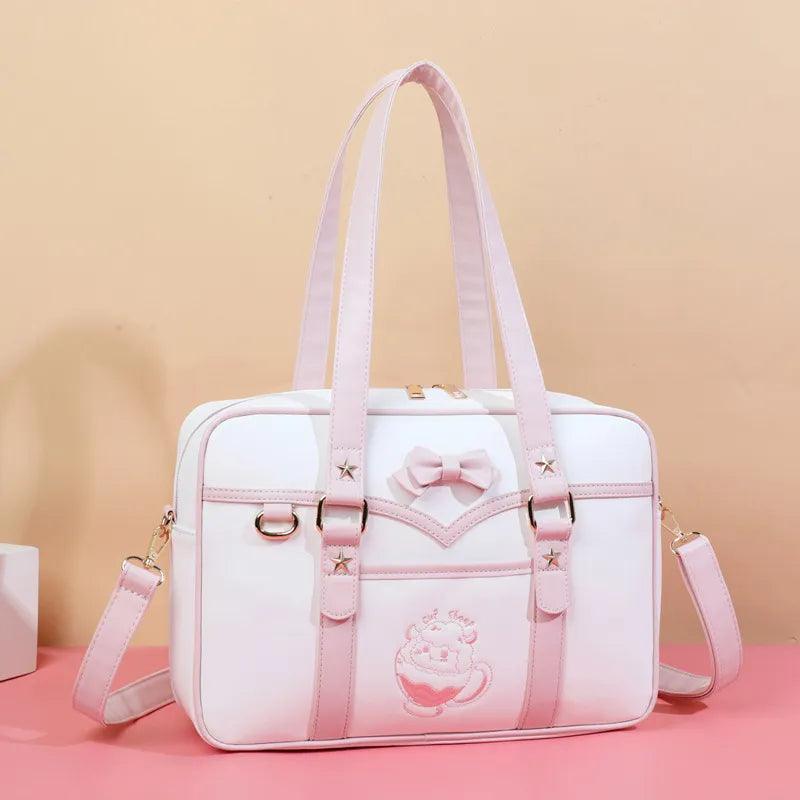 Light pink-and-white kawaii messenger bag with bow front, star accents, and side strap