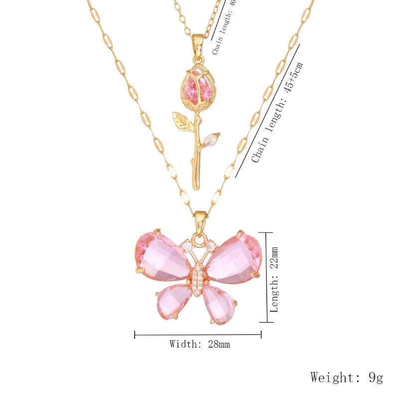 Gold-tone butterfly rose necklace with pink butterfly flower pendant and pink rose teardrop charm