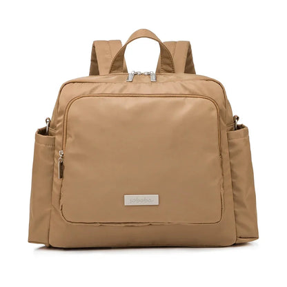 Tan diaper bag backpack with front zip pocket and side zip openings