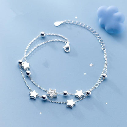 925 sterling silver star charm bracelet with small star and round ball bead accents.