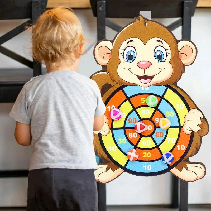 Monkey dart board toy with numbered target rings and colorful sticky balls