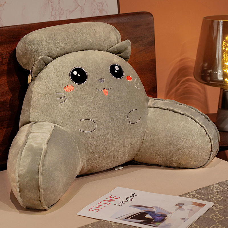 Stuffed animal reading pillow with cute face, light gray plush and rounded body