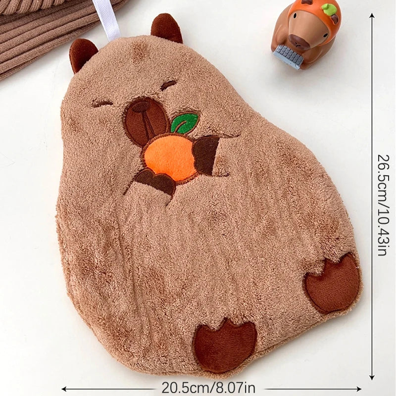 Capybara cotton hand towel with hanging loop, plush back and embroidered orange fruit design